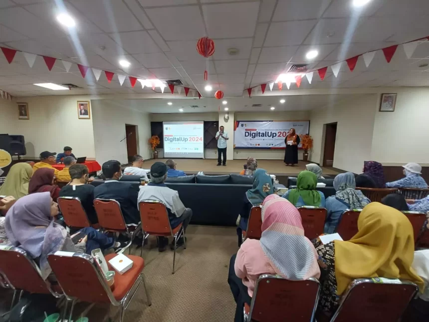 Martinho Vaz memberikan sambutan sekaligus membuka DigitalUp 2024 di aula Perpustakaan Umum